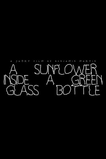 A Sunflower Inside A Green Glass Bottle